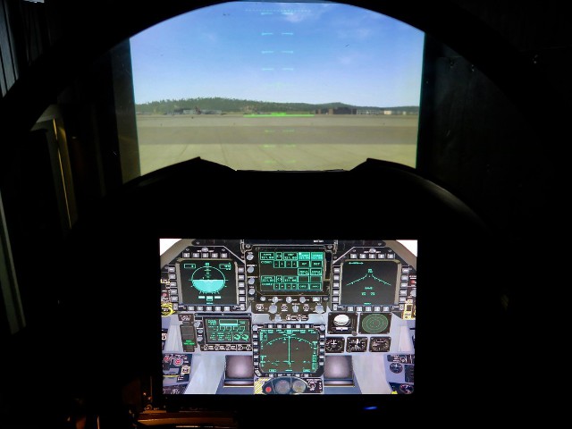 The pilot views the HUD (heads up device) while looking through the cockpit’s windscreen