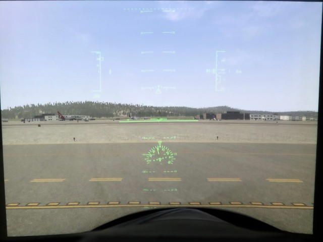Airspeed, altitude, compass heading and other flight variables are in view on the HUD